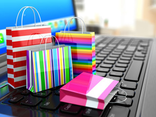 Aufkleber - E-commerce. Online internet shopping. Laptop and shopping bags.
