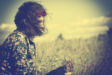 Sad hipster woman and windy weather