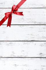 Wall Mural - Old wooden background with beautiful bow