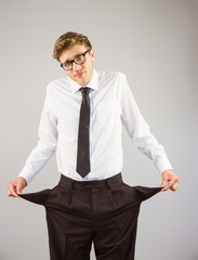 Poster - Geeky businessman showing his empty pockets