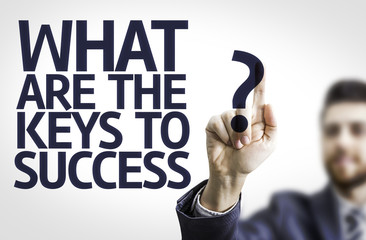 Business man pointing: What Are The Keys to Success?