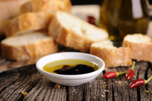 Small Bowl Of Olive Oil And Balsamic Vinegar With Dipping Bread