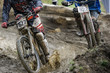 Mountainbikers splashing through mud