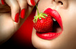Leinwandbild Motiv Sexy Woman Eating Strawberry. Sensual Red Lips