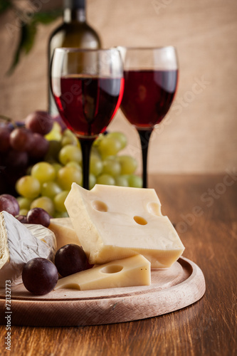 Cheese with a bottle and glasses of red wine Poster