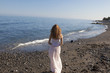 © pfluegler photo - young woman standing on beach