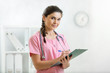 © Oksana Kuzmina - Portrait of female physician with clipboard at office
