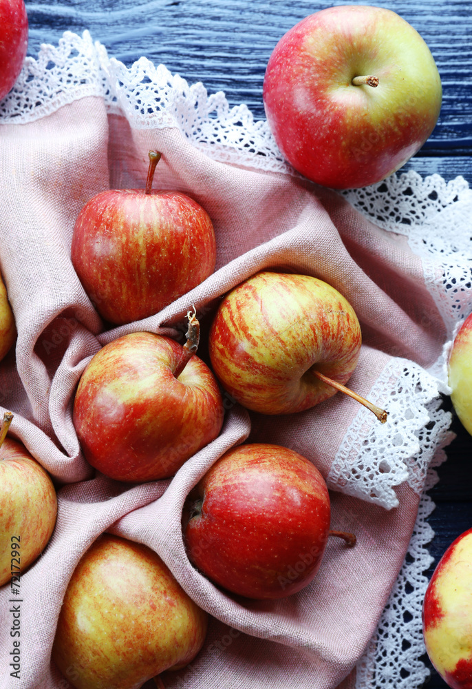 Juicy apples on wooden table, close-up