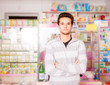 © DC Studio - Handsome guy in front of pharmacy stand