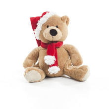 Teddy Bear With Christmas Hat And Scarf Over White Background