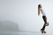 © julenochek - Fashionable woman with a bag in light background