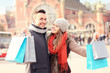 © Kalim - Happy couple shopping in the city