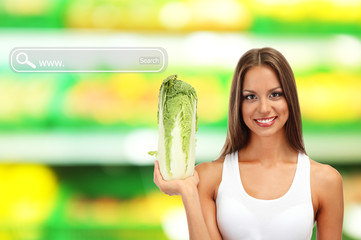 Sticker - Shopping concept. Beautiful young woman with cabbage