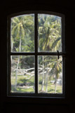 Fototapeta Na ścianę - Indonesian lighthouse window silhouette, palm trees