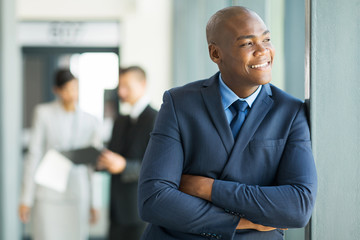 african american businessman looking out the window