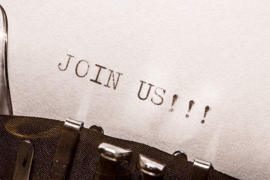 old typewriter with text join us