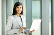 © michaeljung - young indian businesswoman using laptop computer