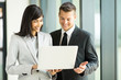 © michaeljung - business team using laptop