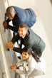 © michaeljung - overhead view of businesspeople looking up