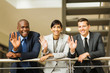 © michaeljung - businesspeople waving in office