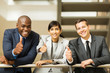 © michaeljung - business group giving thumbs up