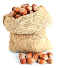 Wall Mural - Hazelnuts in bag isolated on white