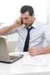 © Studio Gi - Businessman with laptop talkng on the phone