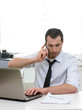 © Studio Gi - Businessman with laptop talkng on the phone