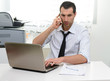 © Studio Gi - Businessman with laptop talking on the phone
