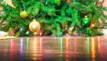 Detail Of Christmas Tree Decorations With Lights Reflections