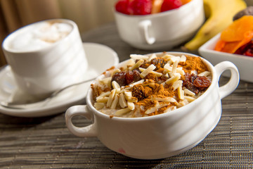 Wall Mural - cappuccino and nutritious oatmeal breakfast