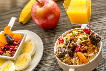 Wall Mural - Fresh fruit and oatmeal with healthy toppings for breakfast