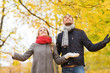 © Syda Productions - smiling couple looking up in autumn park