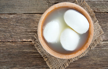 Wall Mural - mozzarella cheese on wooden table