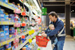© Maria Sbytova - Father and his son at supermarket