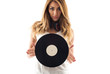 © pio3 - Portrait of a young woman holding a vinyl record against white b