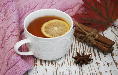 Poster - Cup of hot tea with lemon and scarf