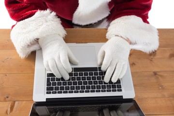 Poster - Santa is writing something on his laptop