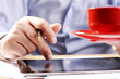 © pfpgroup - Businessman holding coffe cup at work