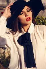 Poster - beautiful ladylike woman in elegant blouse and hat