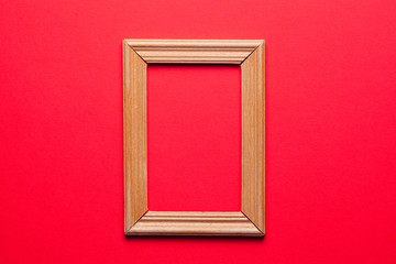 Wall Mural - wooden frame on red background