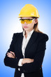 © Elnur - Young businesswoman with hard hat on white