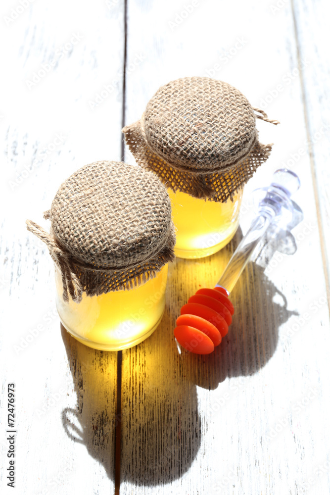 Fresh honey on wooden table