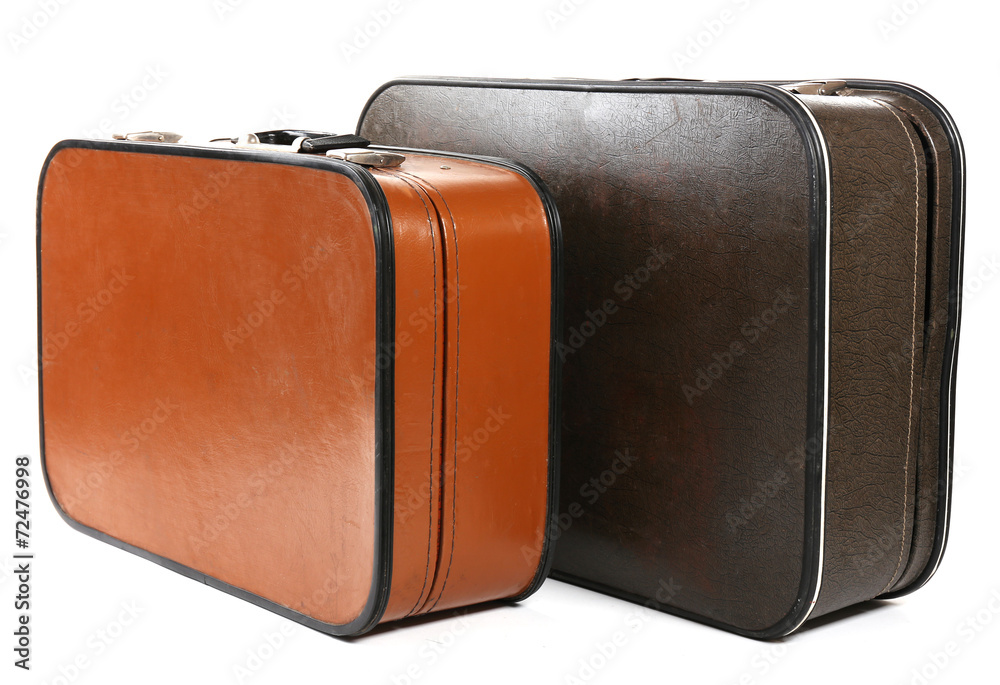 Vintage old travel suitcases, isolated on white