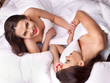 © Gennadiy Poznyakov - Two sexy lesbian women  erotic foreplay game in bed.