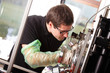 Scientist inserts hand laser deposition chamber