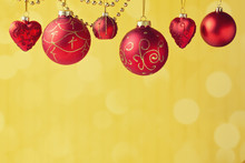 Christmas Decorations Hanging Over Golden Bokeh Background