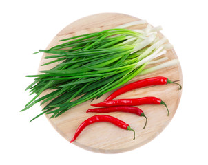 Wall Mural - Bunch of green onion with red pepper.