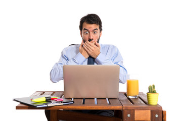 Wall Mural - Businessman in his office doing surprise gesture