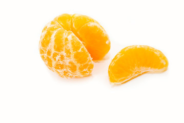 Wall Mural - An Orange Slice Next to a Peeled Orange